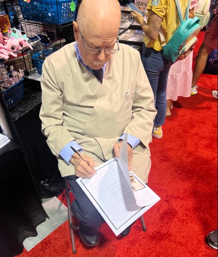 Bob signing Book for Campbells